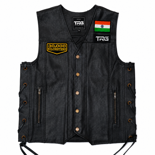 30 Thousand Kilometres embroidered patch attached to black leather motorcycle vest showing front chest placement on white background