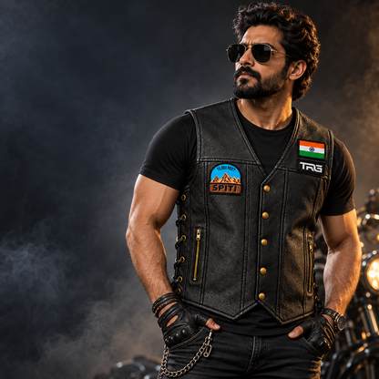15K Feet Spiti embroidery patch shown on black TRG leather riding vest worn by a rider in a studio motorcycle setup.