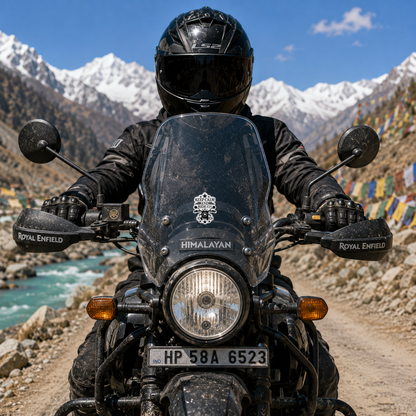 Keep Calm and Ride On sticker centered on Royal Enfield Himalayan motorcycle windshield on a Himalayan mountain road