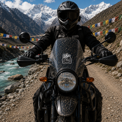 Biker Sticker installed on motorcycle windshield during Himalayan adventure ride with rider, mountain road and prayer flags