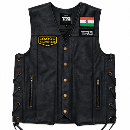 10 Thousand Kilometres embroidered patch attached to black leather motorcycle vest on white background