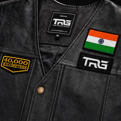 Close-up of 40 Thousand Kilometres embroidered patch on black leather vest showing detailed stitching