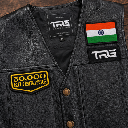 Close-up of 50 Thousand Kilometres embroidered patch on black leather riding vest