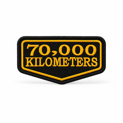 70 Thousand Kilometres embroidered patch in black and yellow with high-density embroidery and precision border