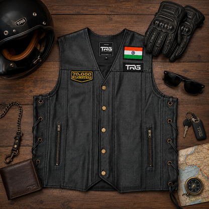 70 Thousand Kilometres embroidered patch displayed on black leather vest with motorcycle riding accessories