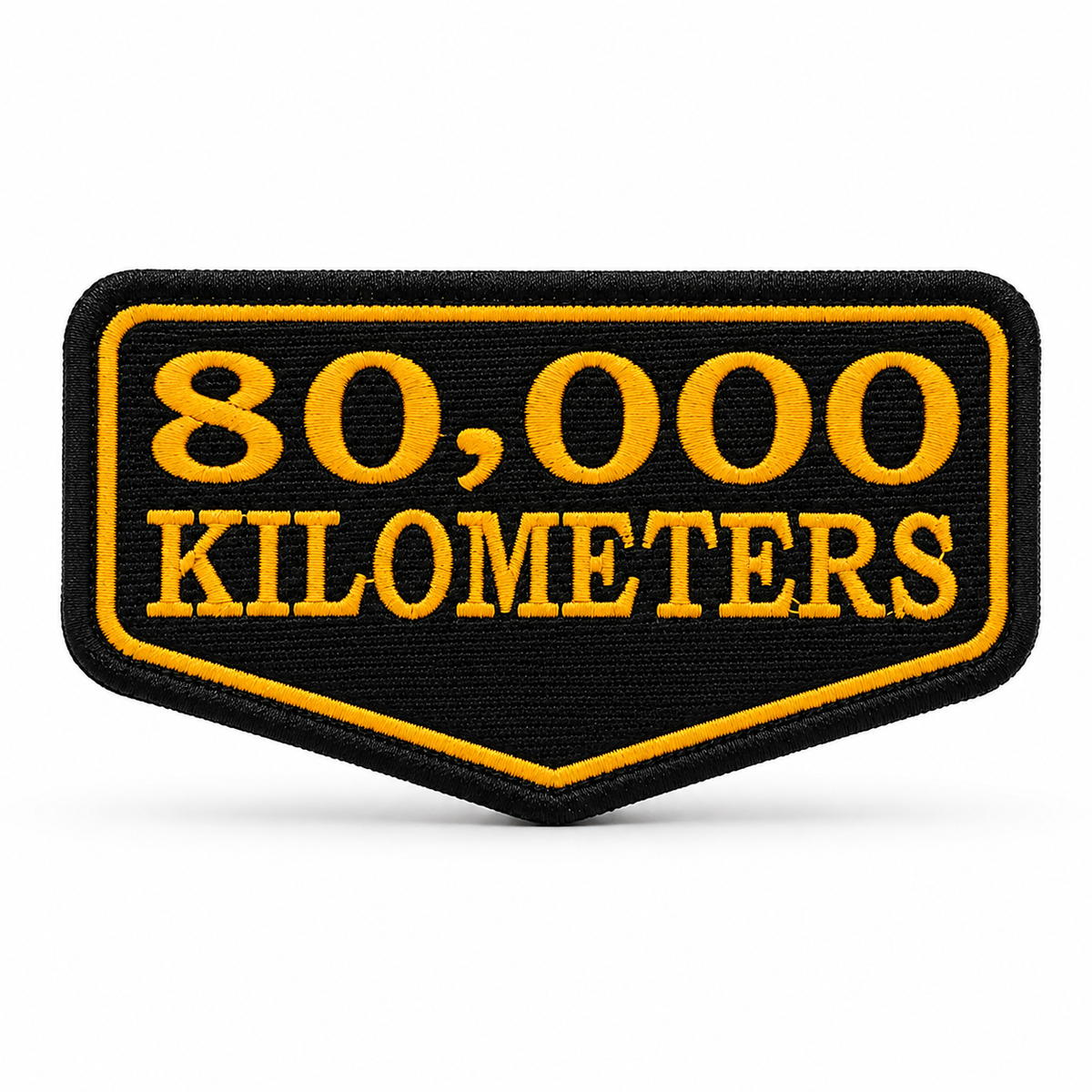 80 Thousand Kilometres embroidered patch in black and yellow with high-density embroidery and precision border