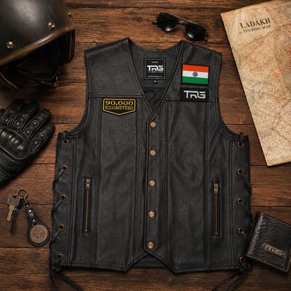 90,000 Kilometres embroideredpatch displayed on black leather motorcycle vest with riding accessories