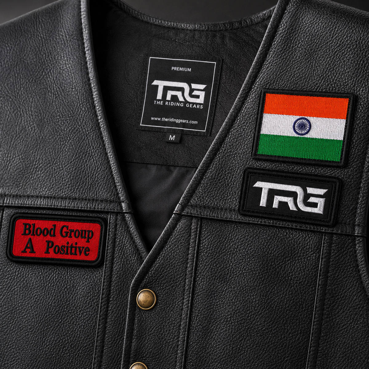 Close-up of A Positive Blood Group embroidered patch on black leather biker vest showing red and black embroidery