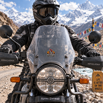 Motocross Creative Slocan dirt bike sticker displayed on Royal Enfield Himalayan motorcycle windshield in Himalayan riding setting