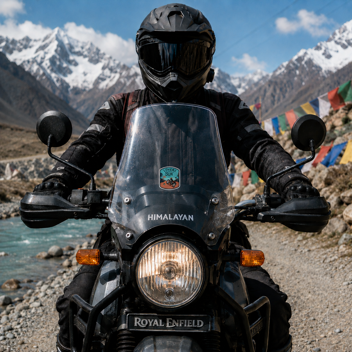 Lovers of the Sun motorcycle sticker centered on Royal Enfield Himalayan windshield in scenic Himalayan mountain riding setting