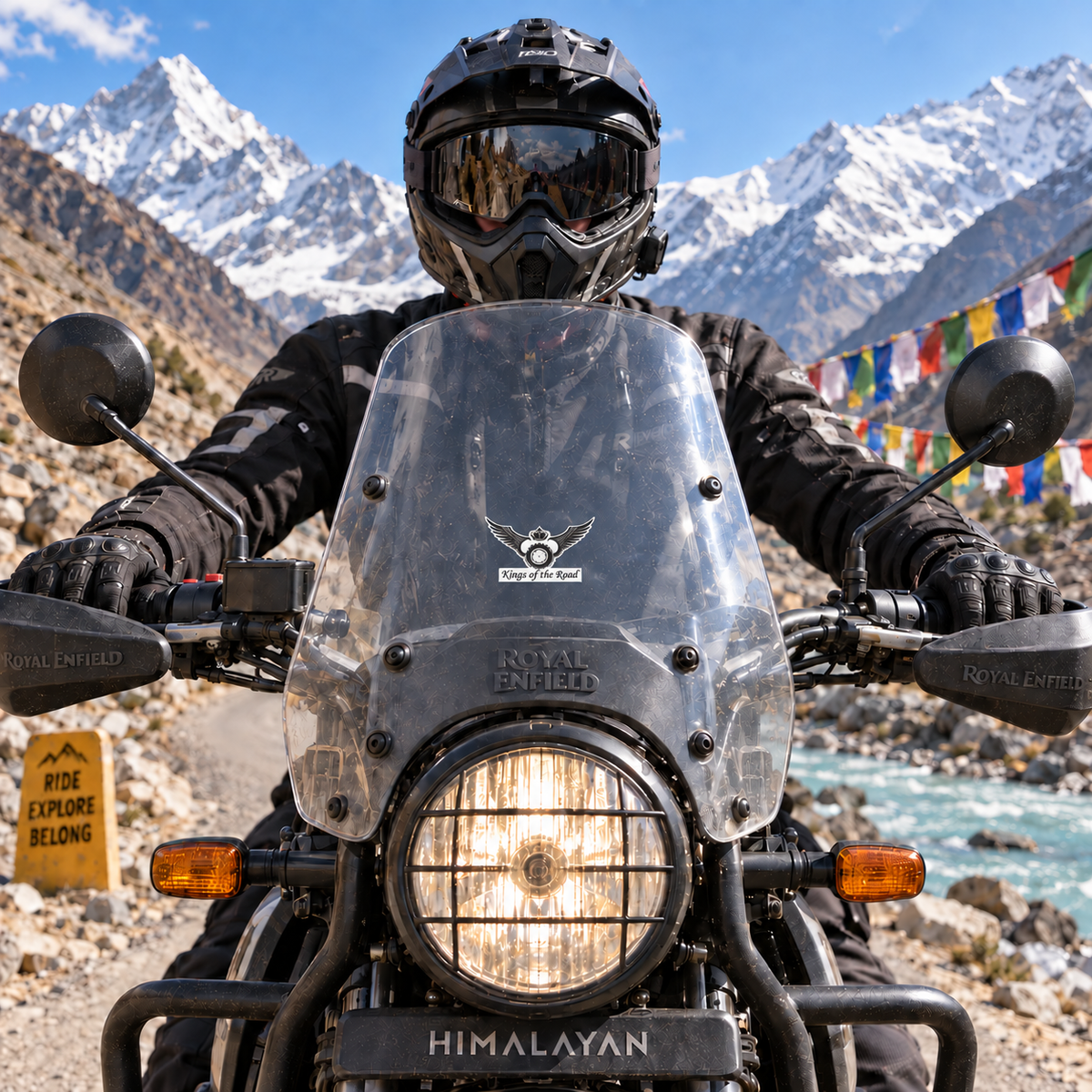 King of the Road sticker centered on Royal Enfield Himalayan motorcycle windshield on a Himalayan mountain road