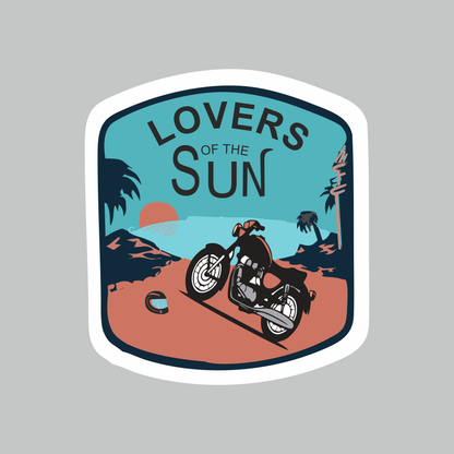 Lovers of the Sun biker vinyl sticker featuring motorcycle, sunset and tropical landscape artwork in blue, orange and black