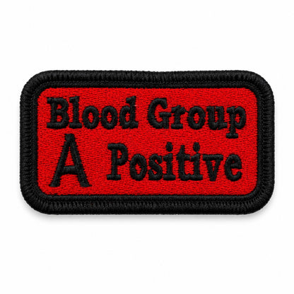 A Positive Blood Group embroidered patch in red and black with premium stitched border on white background