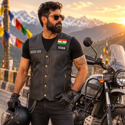 Biker patch Reaper Crew worn on black leather motorcycle vest by rider in mountain setting