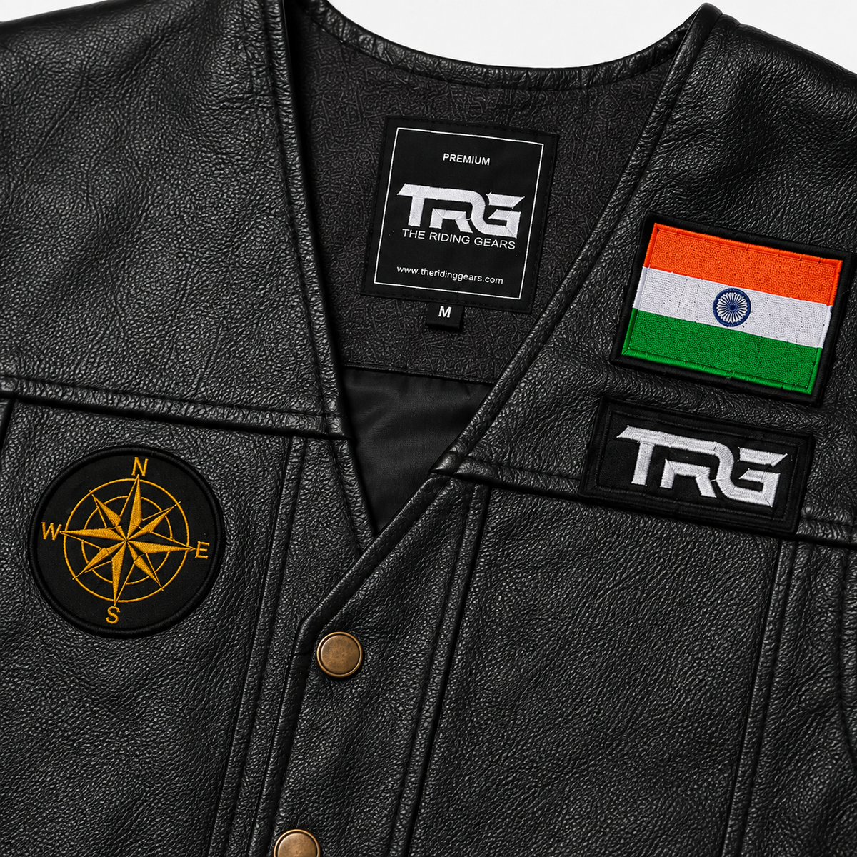 Compass Biker Patch close-up showing golden compass embroidery on black leather riding vest