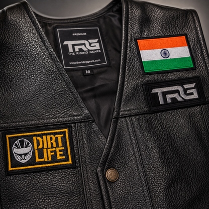 Dirt Life Biker Patch close-up showing yellow white and black embroidery on leather motorcycle vest