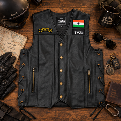 Gwalior embroidered front patch displayed on a black leather biker vest with motorcycle riding accessories.