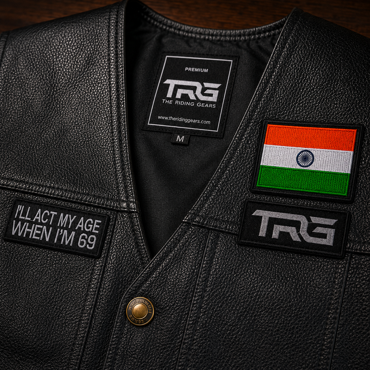 Biker Patch I'll Act My Age When I'm 69 close-up showing white embroidery on black riding vest