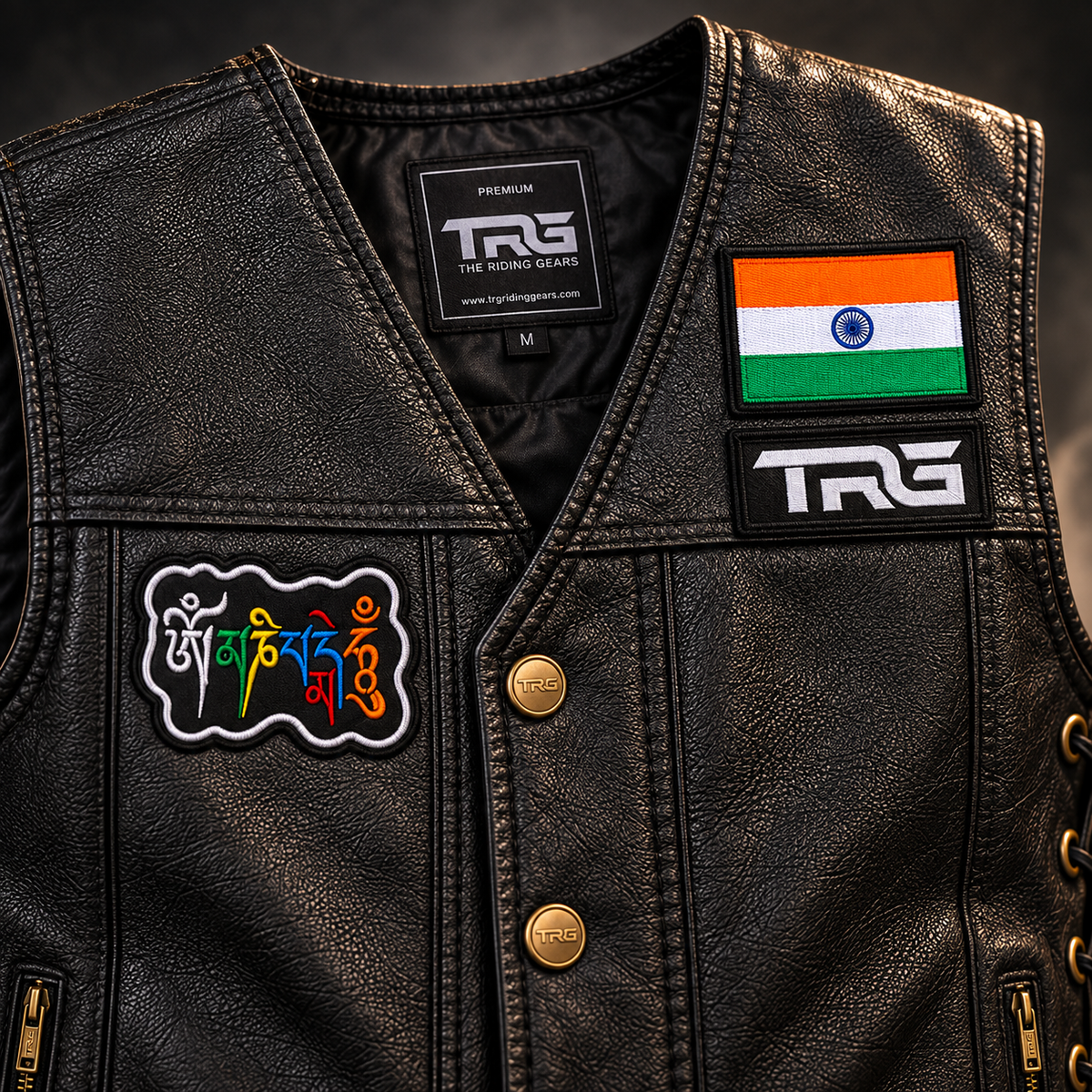 Om Mani Padme Hum Biker Patch close-up showing multicolor embroidered mantra design on black leather vest