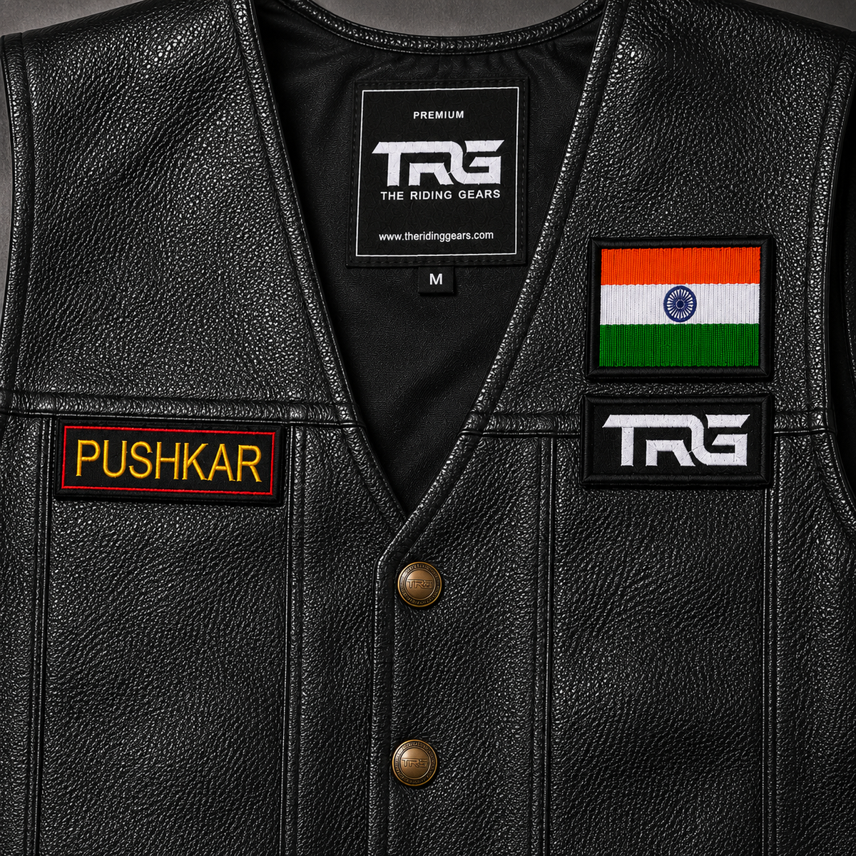 Close-up of Pushkar Embroidery Patch on a TRG black leather riding vest with Indian flag patch and TRG chest patch.