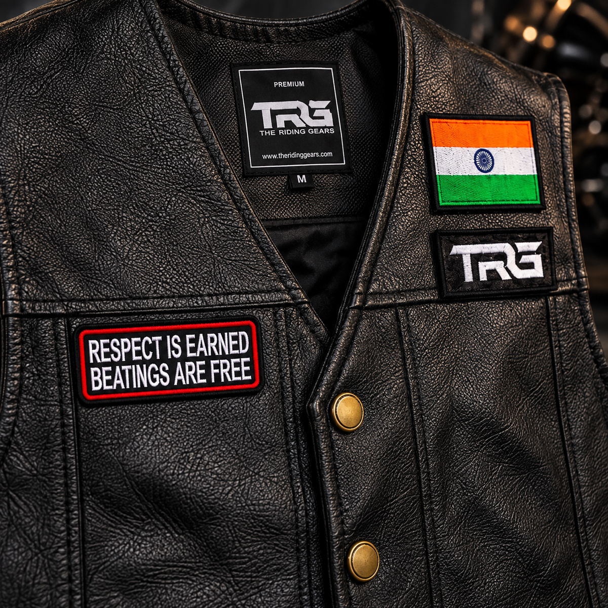 Respect Is Earned Beatings Are Free close-up showing detailed embroidery on black leather riding vest.