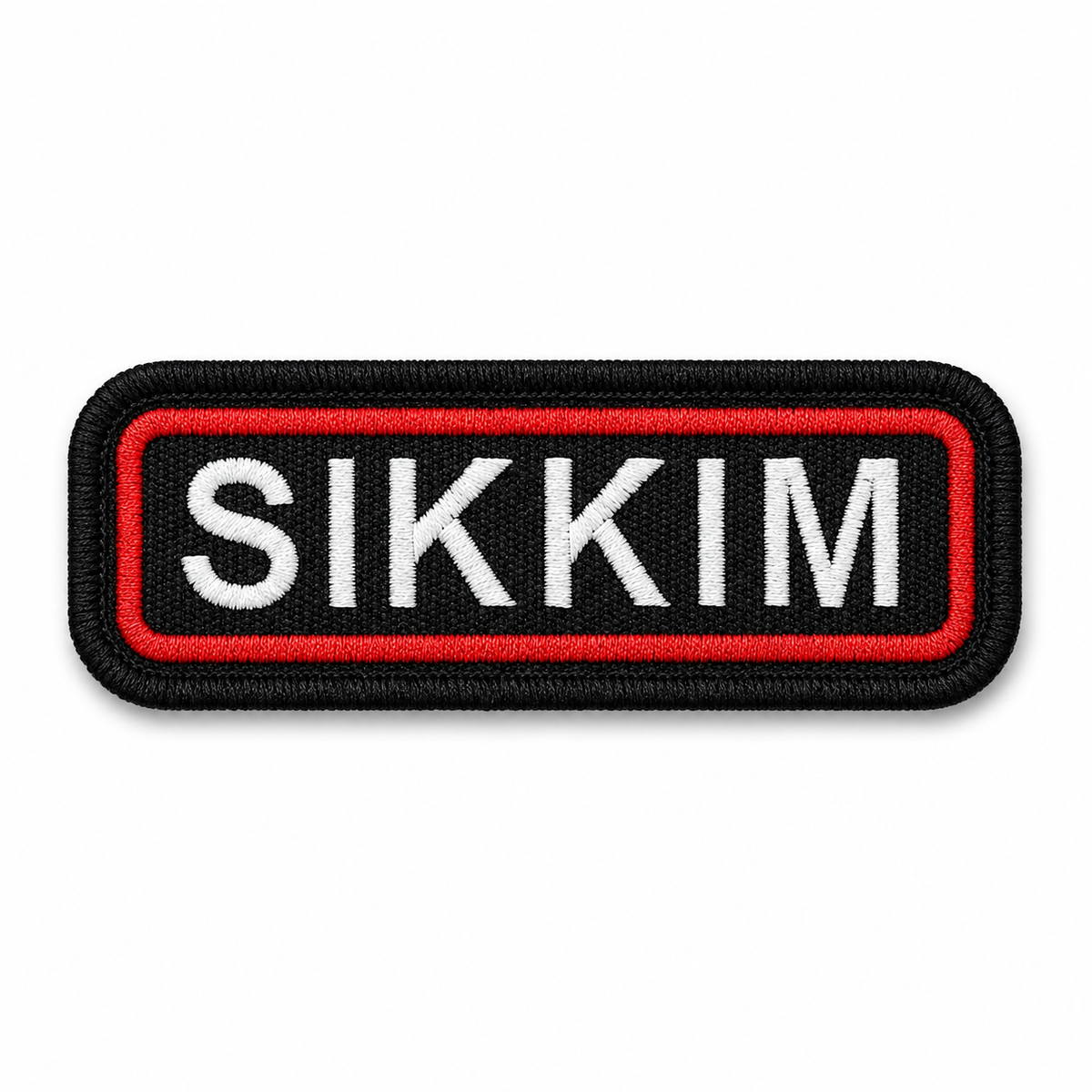 Sikkim Embroidery Patch with white lettering, black base and red embroidered border on white background.