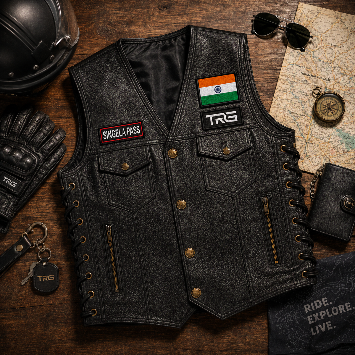 Singela Pass expedition embroidery patch by TRG displayed on a black riding vest in a premium flat lay setup