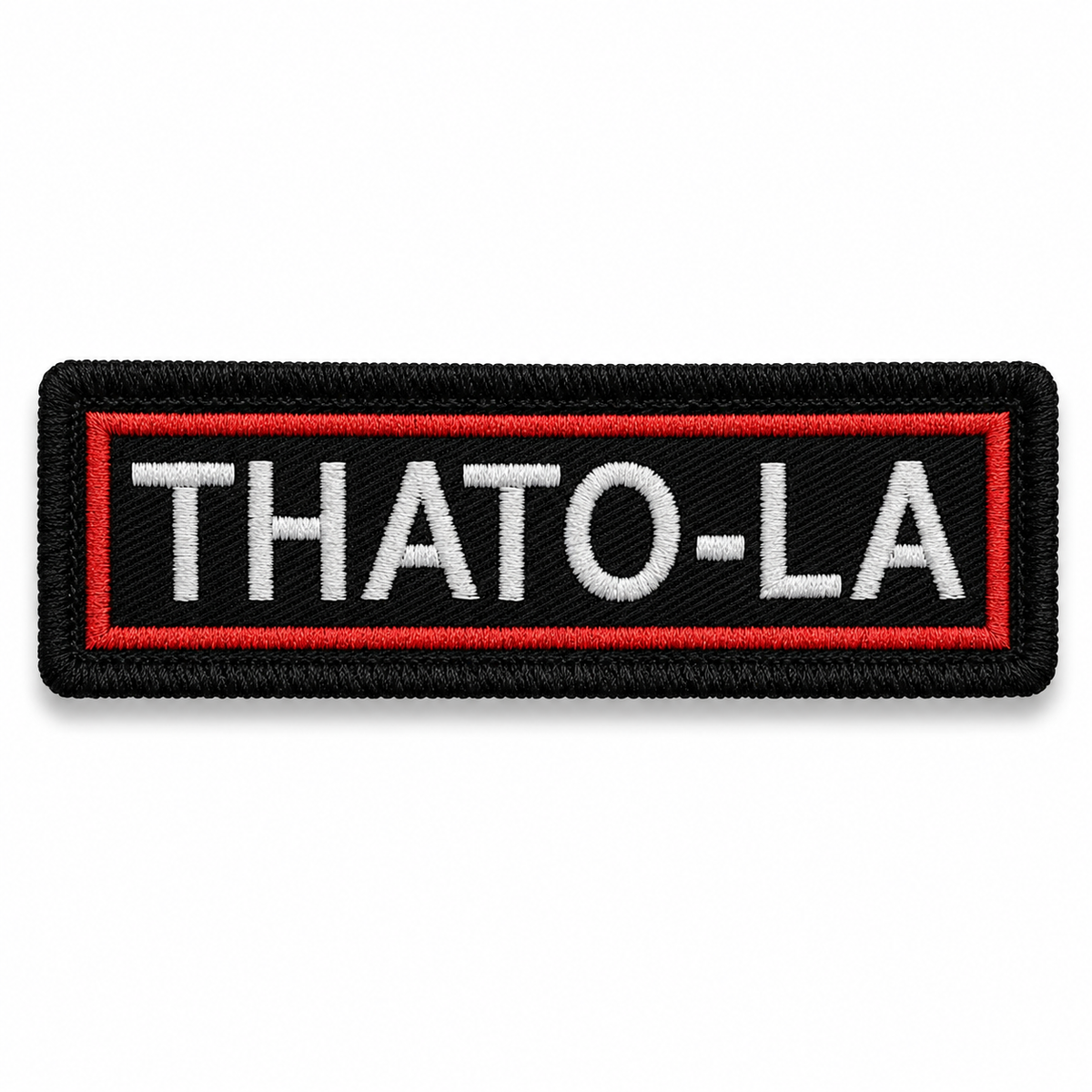 Thato-La biker patch by TRG on white background with black base red border and white embroidered lettering
