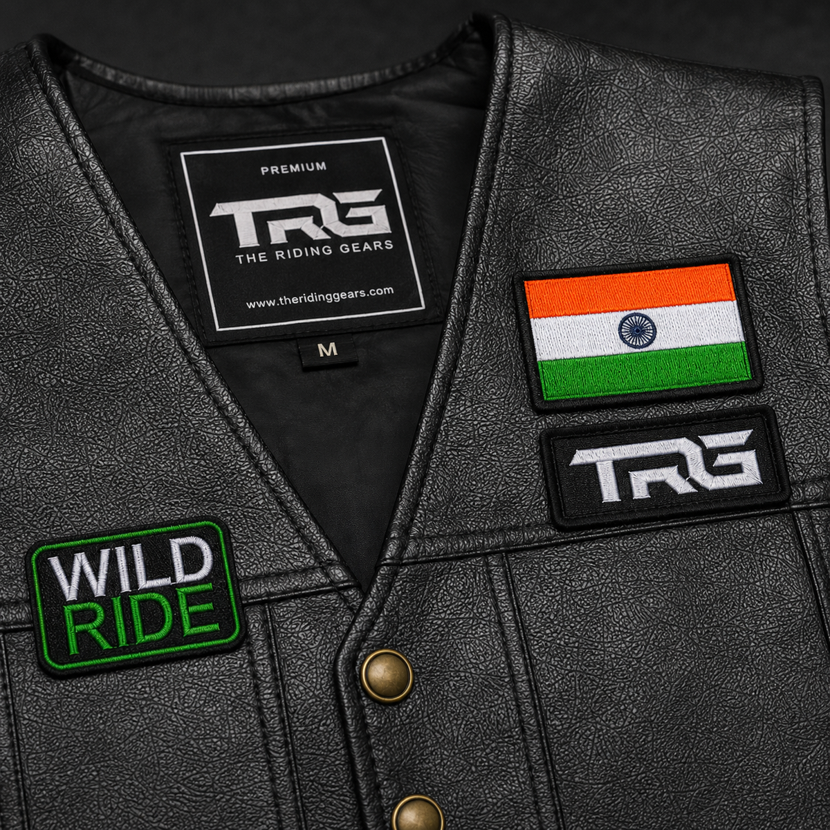 Wild Ride Biker Patch close-up showing green and white embroidery on black riding vest